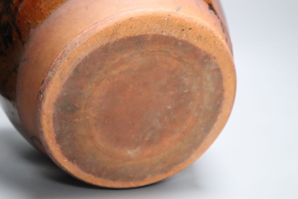 A 19th century Sussex terracotta jug, with black striped glaze, height 30cm (a.f.)